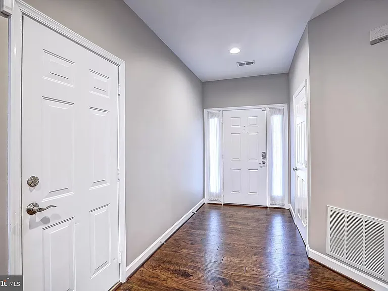 Entry way with garage door on the left side and coat closet on the right side