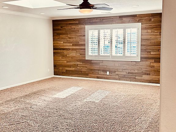 Oversized living room with natural light and skylight