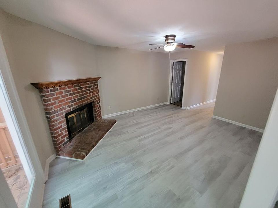 Living Room with brick fireplace