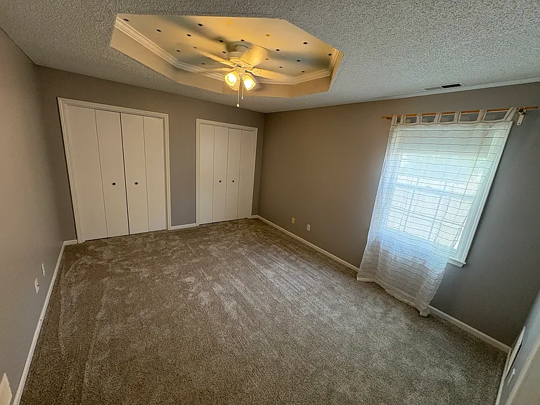 First floor bedroom with new paint and carpeting (June 2025).