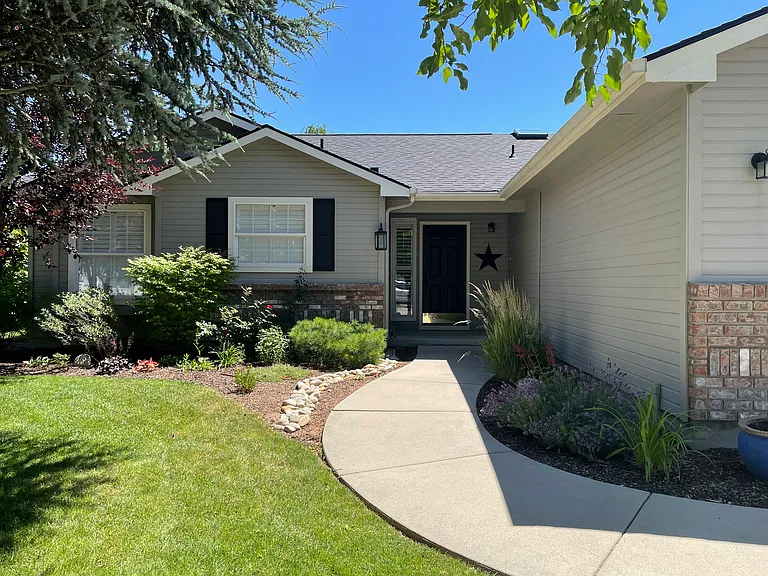 Mature landscaping and walking path to front door