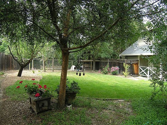 yard behind 3 car garage with full apartment 