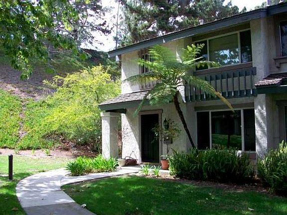 beautiful grounds surround this end unit