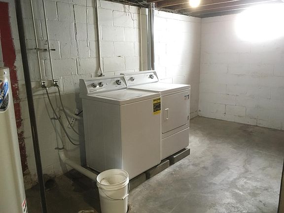 Laundry in unfinished basement
