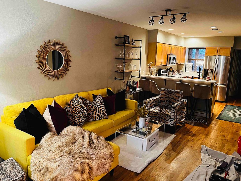 Living room area. An open, updated kitchen is in the background.