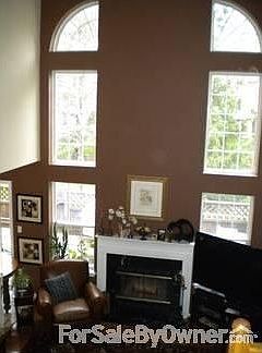 Family Room : 18ft ceiling and paladain windows. Wood-burning fireplace, hardwood flooring