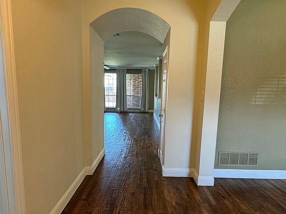Stunning handscraped nailed down hardwood floors. Entry opens to dining to right and office to left