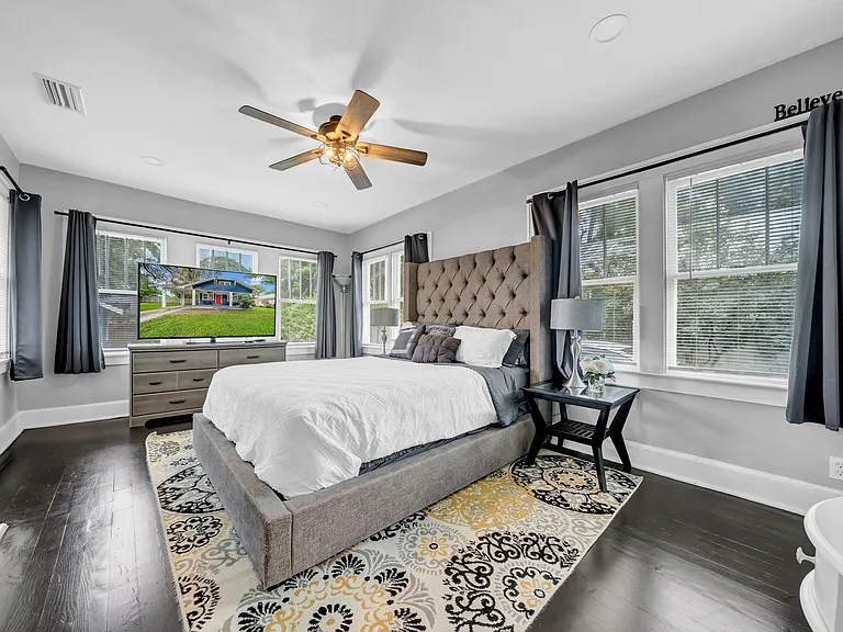 Primary bedroom with walk-in closet and direct access to the backyard