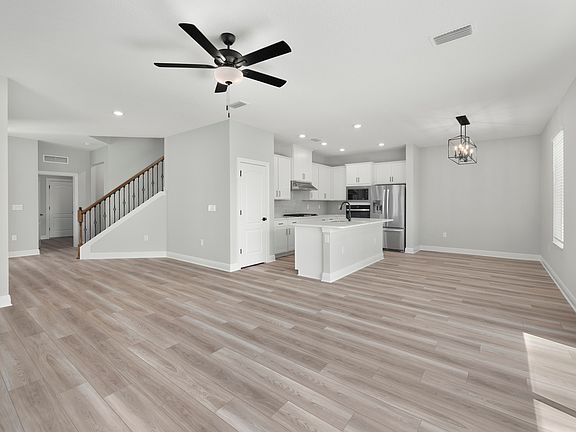 Expansive entertaining area with luxury vinyl flooring