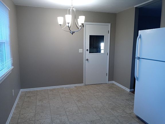 Eat-in-kitchen. The door exits to the garage. The living room is to the right. (Pictures of the living room and garage coming soon)