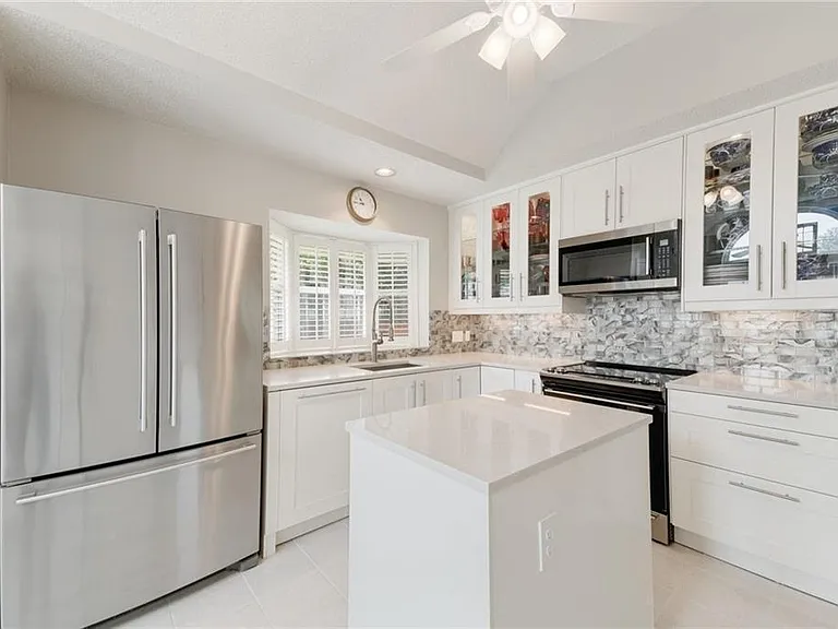 Well finished kitchen with bay window.
