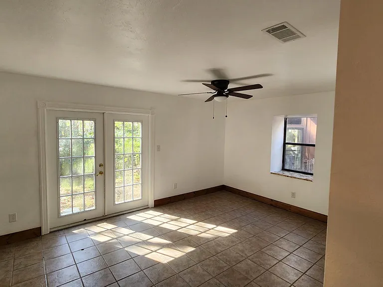 master bedroom/den with large walk in closet