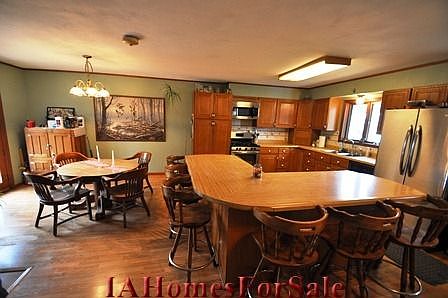 Kitchen and Dining Area with French doors to deck