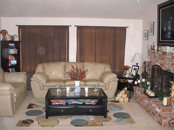 Living room with brick fireplace