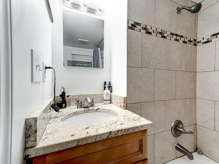 Granite vanity with maple cabinetry!