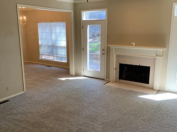 Living Room w/ Fireplace looking into the Formal Dining Room