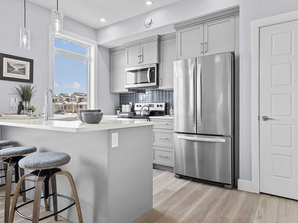A photo of the kitchen of the Coltrane townhome model by Brookfield Residential