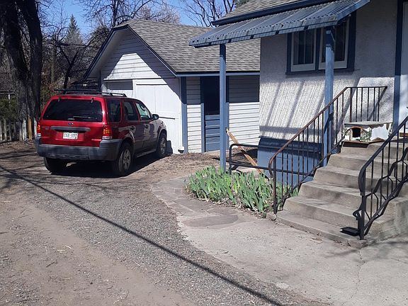 Parking space by entrance in front of garage; lighted with motion detector
