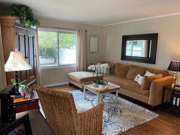 Living room: Home offered is unfurnished; photos from recent occupant.