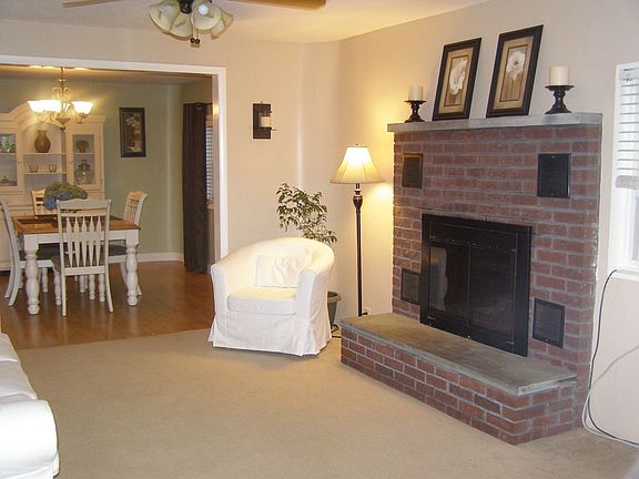 Living Room w/ fireplace & Dining Room
