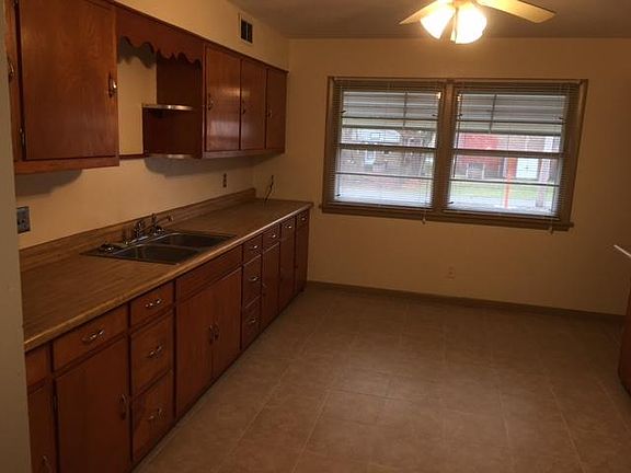 LARGE KITCHEN WITH CERAMIC TILE FLOOR, VIEW IS BACK YARD