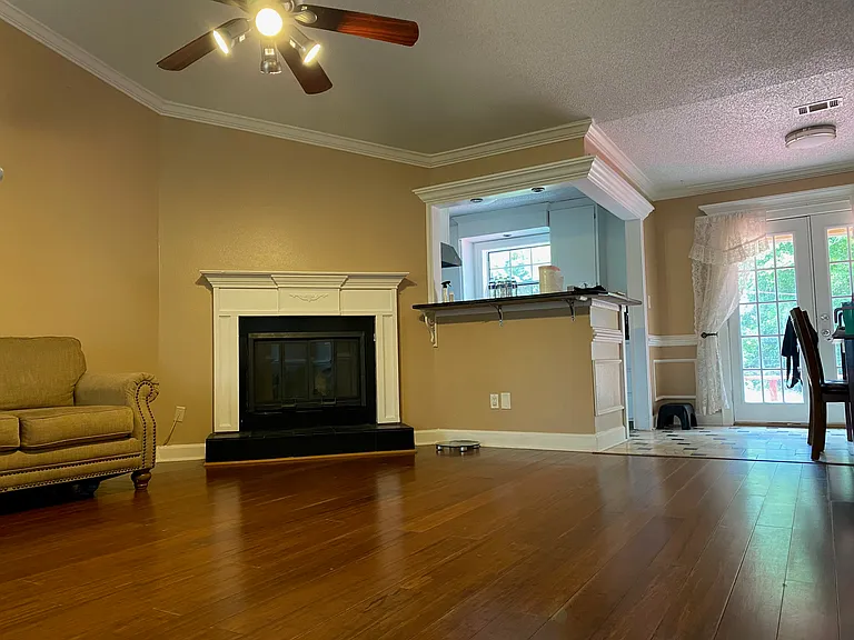 Bright and spacious living room with plenty of natural light, perfect for relaxing and entertaining