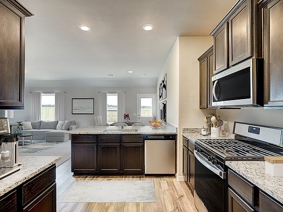 Enjoy a chef-ready kitchen with upgraded, stainless steel appliances.
