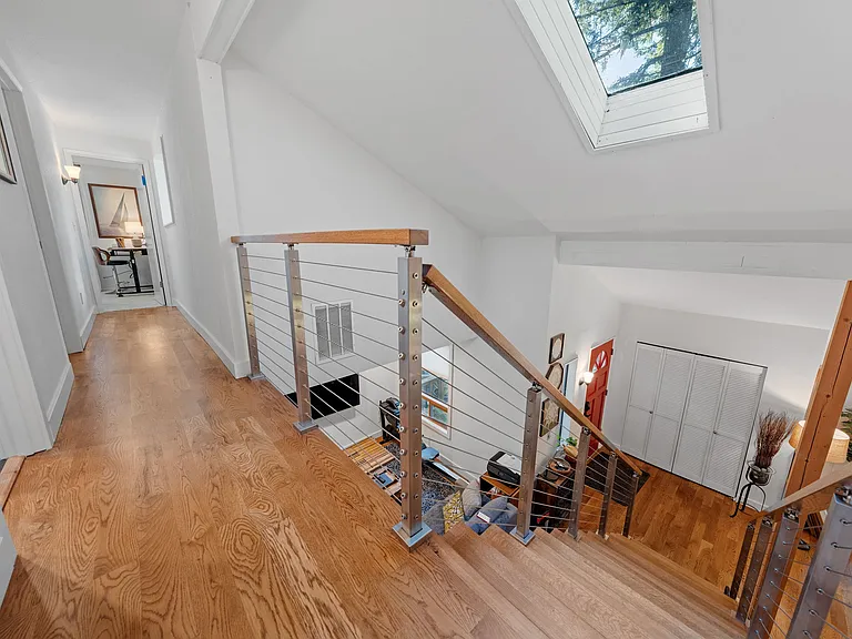 Upstairs Hallway view to the TV room and entry