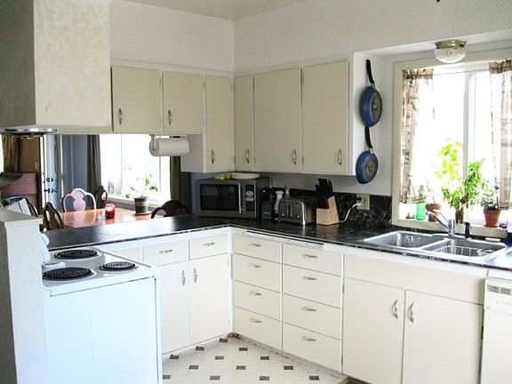 Kitchen has new laminate counter tops, tile back splash, new paint and new refrig and range.