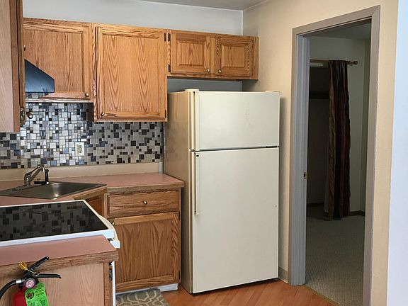 Kitchen looking into bedroom