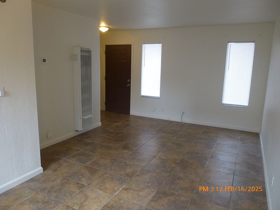 looking at living room from sliding glass door to outside patio area