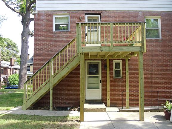 Back of apartment showing back entryway through kitchen and pack patio.