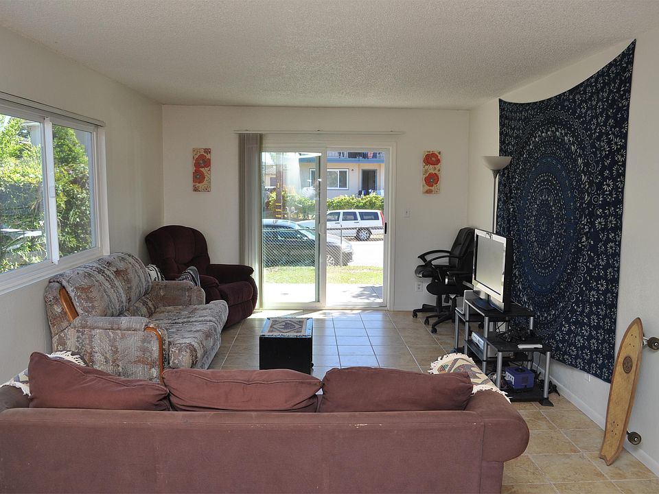 Large living room with sliding doors to front yard brand new tile installed June 2014