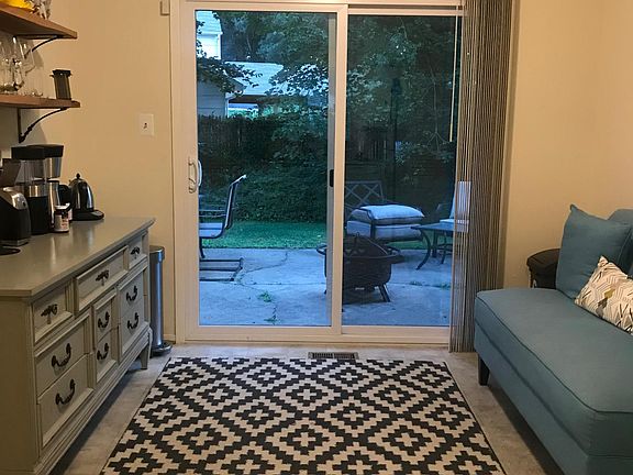 Eat in Kitchen with new slider to private patio with a yard and trees.