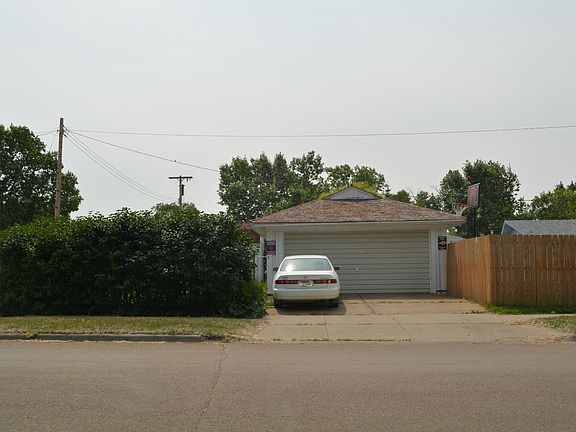2 car garage/ lilac trees
