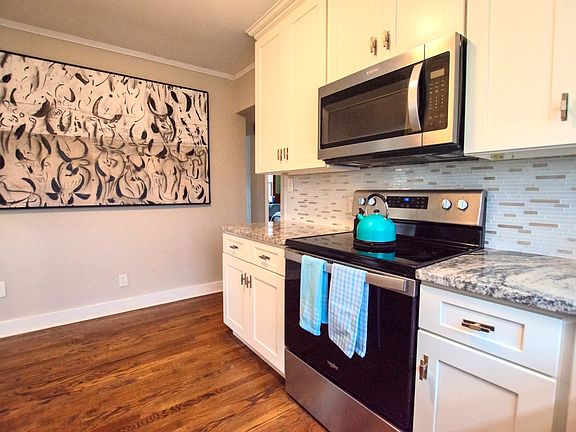 Updated kitchen with lots of storage, fully stocked for all your cooking needs!