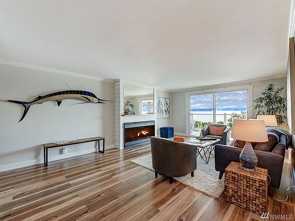 The living room is warm and inviting and open to the view.