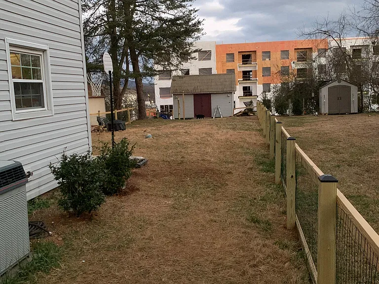 fenced in backyard with shed