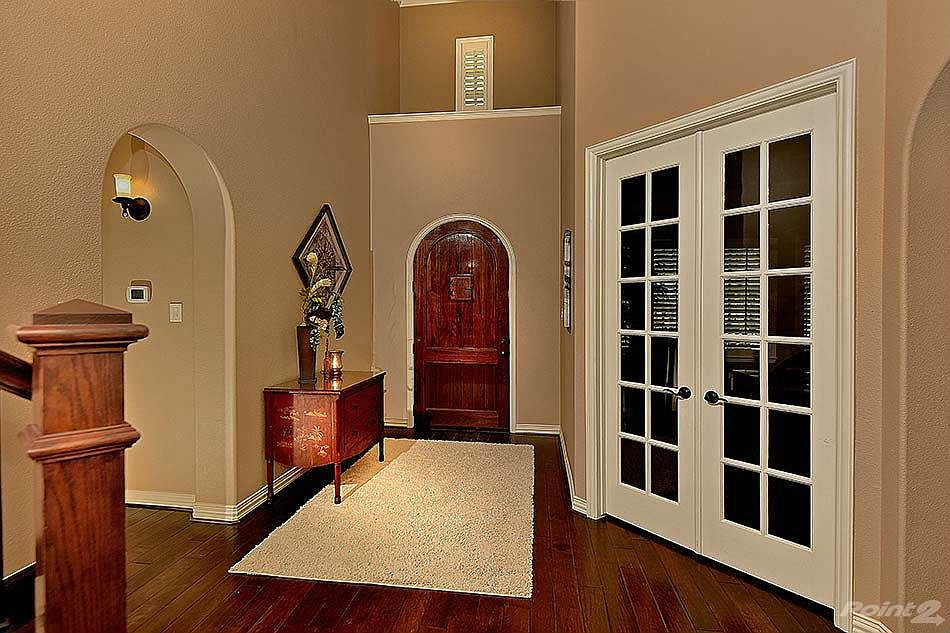 Beautiful two story entry with hardwood floors.
