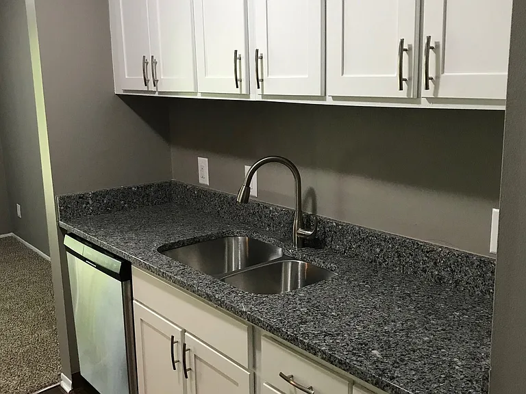 Galley-Style Kitchen With Stainless Appliances