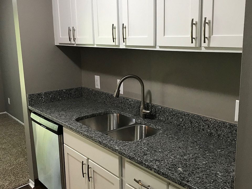 Galley-Style Kitchen With Stainless Appliances