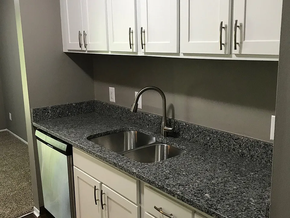 Galley-Style Kitchen With Stainless Appliances