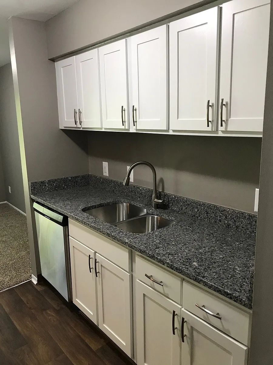 Galley-Style Kitchen With Stainless Appliances - Brighton Glens