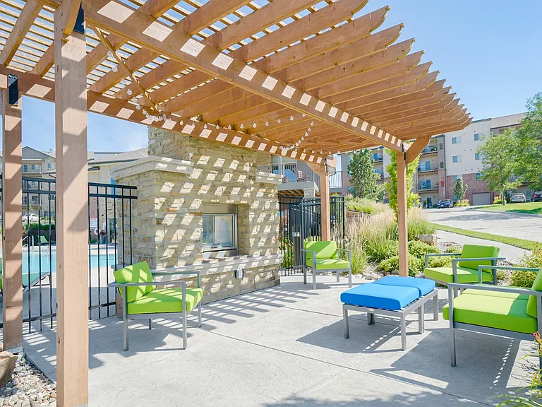 Enjoy a cozy evening by our poolside fireplace and lounge area.