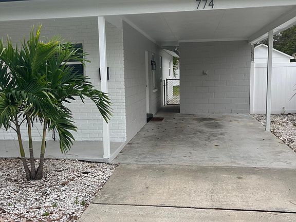 Carport area, looking at laundry room/storage area.