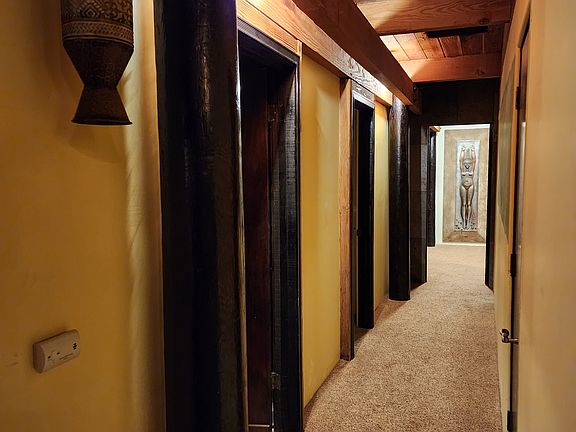 Leading to office, guest bedrooms, and master.