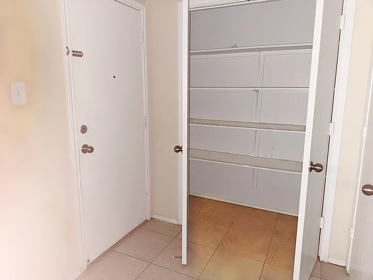 A large pantry within the kitchen and across from the laundry.
