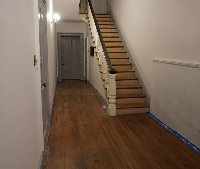 Door to the apartment is on the left. You won't need to climb the stairs!