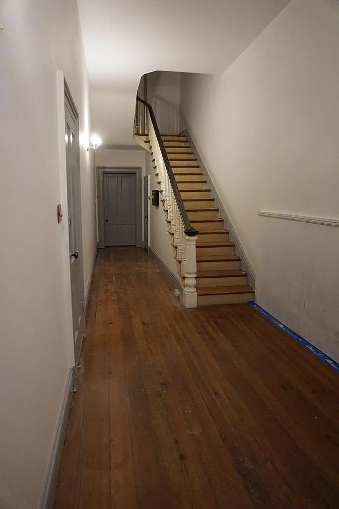 Door to the apartment is on the left. You won't need to climb the stairs! - 226 E Patrick St #1A