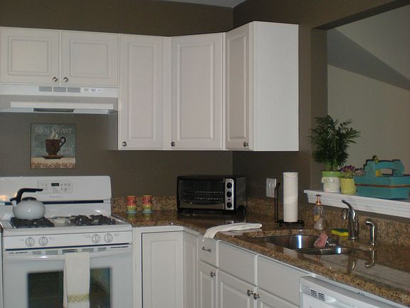Kitchen with opening above staircase